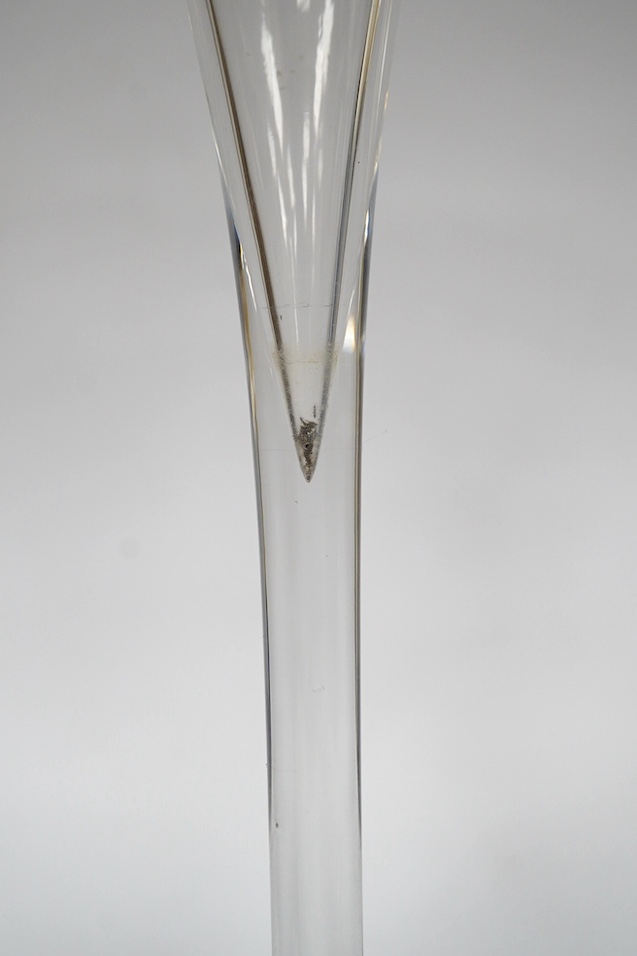 Two drawn trumpet wine glasses, late 18th century and a balustroid gin glass, c.1740, 12.4cm - 18.7cm high (3). Condition - the slender trumpet wine glass has some glue residue to the pontil mark but there is no evidence